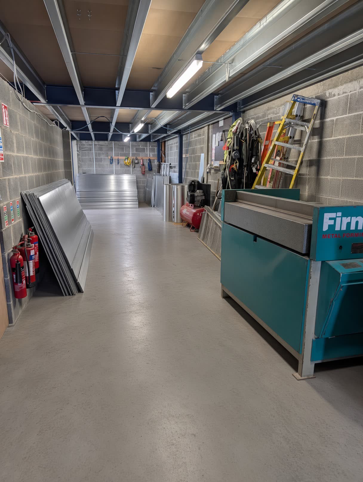 Folded aluminium sheet and coil in the CladFab stores bay